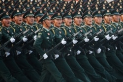Soldiers of People's Liberation Army (PLA) march in formation past Tiananmen Square during a rehearsal before a military parade marking the 70th founding anniversary of People's Republic of China, on its National Day in Beijing, China, Oct. 1, 2019.