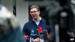 Serbia's President Aleksandar Vucic, addresses the media outside a polling station, in Belgrade, Serbia, Sunday, June 21, 2020.