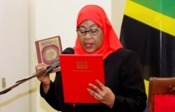 FILE PHOTO: Tanzania's President Samia Suluhu Hassan takes oath of office in Dar es Salaam, Tanzania March 19, 2021.