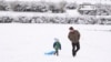 Winter storm dumps snow in US South, maintains its icy grip 