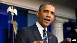 President Barack Obama gestures while making a statement regarding the budget fight in Congress and foreign policy challenges, Sept. 27, 2013, at the White House in Washington. 