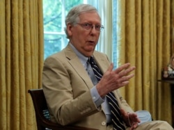 FILE - Senate Majority Leader Mitch McConnell speaks about legislation for additional coronavirus aid during a meeting with President Donald Trump in the Oval Office, July 20, 2020.