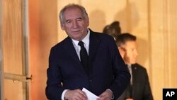 Newly named Prime Minister François Bayrou stands after the handover at the prime minister residence, Dec. 13, 2024 in Paris. 