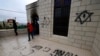Israeli settlers accused of setting fire to and vandalizing West Bank mosque