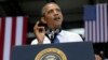 President Barack Obama gestures as he speaks at the Amazon fulfillment center in Chattanooga, Tennessee, July 30, 2013. 