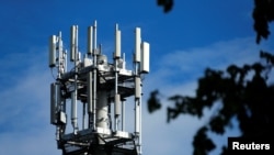 FILE - Relay antennas for mobile phone networks are pictured on a relay mast near Gross-Gerau, Germany, Apr. 25, 2019. 