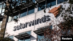 FILE - The SolarWinds logo is seen outside its headquarters in Austin, Texas, Dec. 18, 2020.