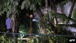 Authorities conduct a search after an explosion near the Israeli Embassy in New Delhi on Dec. 26, 2023.