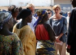 FILE - U.S. Ambassador to the United Nations Samantha Power speaks to IDP women at the makeshift camp where over 40,000 found refuge at the airport in Bangui, Central African Republic, Dec. 19, 2013.