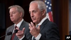 Senate Foreign Relations Committee Chairman Sen. Bob Corker, R-Tenn., joined at left by Sen. Lindsey Graham, R-S.C., speaks with reporters after his panel approved the &quot;Taylor Force Act,&quot; which suspends U.S. financial aid to the Palestinian Authority, at the Capitol in Washington, Aug. 3, 2017. 
