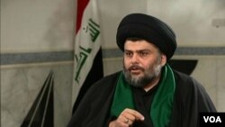 FILE - Shi'ite cleric Moqtada al-Sadr speaks with the Alhurra television network. 