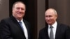 Russian President Vladimir Putin, right, and U.S. Secretary of State Mike Pompeo, pose for a photo before their talks in the Black Sea resort city of Sochi, southern Russia, May 14, 2019. 