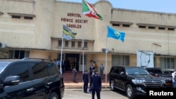 FILE - Security officials keep watch outside the Prince Regent Charles Hospital as Burundi's Prime Minister Alain-Guillaume Bunyoni visits the victims of an explosion, in Bujumbura, Burundi, September 21, 2021. 