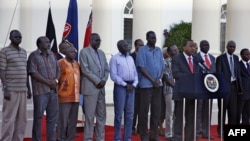 The seven detainees from South Sudan, shown here with Kenyan President Uhuru Kenyatta, after they were released to his custody, will be a third party at peace talks for South Suidan, along with pro- and anti-government negotiators. 