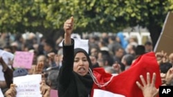 Protesters shout slogans during a demonstration in Tunis, Jan. 19. 2011.