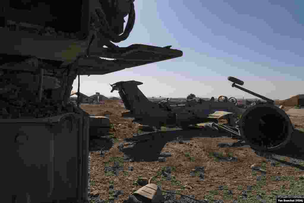 Airplanes were destroyed by Israeli air strikes that hit the Mazzeh air base multiple times in the last week, in Damascus, on Dec. 19, 2024. (Yan Boechat/VOA)