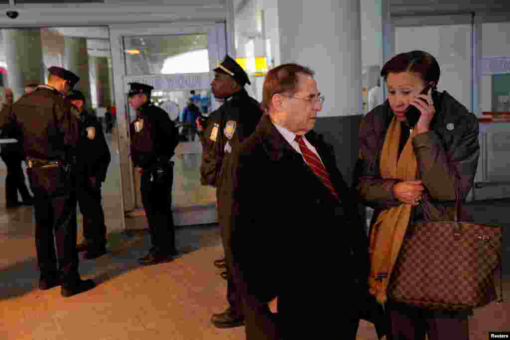 Congressman Jerrold Nadler, left, and Congresswoman Nydia Velazquez, right, stand in the entrance of Terminal 4 at John F. Kennedy International Airport in Queens, New York, Jan. 28, 2017. 