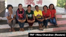 The women in Pamantingan village are among the millions of Filipino women who moved to cities and other countries to find jobs, leaving their families behind, March 20, 2018. 