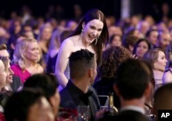 Rachel Brosnahan accepts the award for outstanding performance by a female actor in a comedy series for "The Marvelous Mrs. Maisel" at the 25th annual Screen Actors Guild Awards on Sunday, Jan. 27, 2019, in Los Angeles.