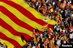 Pro-unity supporters take part in a demonstration in central Barcelona, Spain, Oct. 29, 2017.