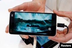 The new ZTE Grand S Lite is pictured during the Mobile World Congress in Barcelona, Spain, Feb. 25, 2013.