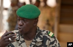 FILE - Coup leader Capt. Amadou Haya Sanogo addresses the press at junta headquarters in Kati, outside Bamako, Mali, March 30, 2012.