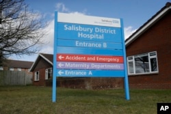 A entrance sign stands outside Salisbury District Hospital where former Russian double agent Sergei Skripal and his daughter, Yulia, were taken after being found critically ill March 4, 2018, in Salisbury, England.