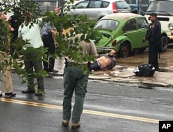 FILE - Ahmad Khan Rahami is taken into custody after a shootout with police, Sept. 19, 2016.