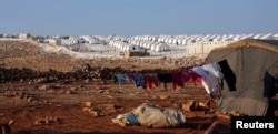 FILE - A general view of a camp for internally displaced persons, in Atimah village, Idlib province, Syria, Sept. 11, 2018.