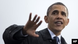 President Barack Obama speaks at a campaign event at rainy Cleveland State University, Friday, Oct. 5, 2012.