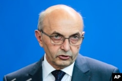 The Prime Minister of Kosovo Isa Mustafa attends a news conference in Berlin, Germany, June 30, 2015.