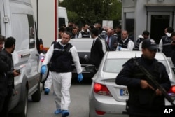 Turkish police gather outside the residence of the Saudi consul General Mohammed al-Otaibi to conduct a search after the disappearance and alleged slaying of writer Jamal Khashoggi, in Istanbul, Oct. 17, 2018.