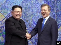 FILE - North Korean leader Kim Jong Un, left, and South Korean President Moon Jae-in inside the Peace House at the border village of Panmunjom in Demilitarized Zone, South Korea, April 27, 2018.