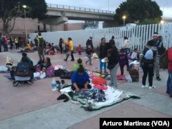 While around 50 asylum seekers entered the El Chaparral port of entry, waiting to be attended, 150 others spent the night outside the gate in Tijuana, Mexico.