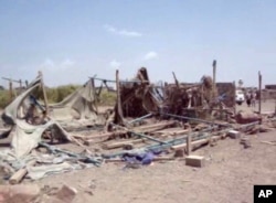 This still image taken from video shot Sept. 28, 2015, shows destruction to buildings after an airstrike hit a wedding party in al-Wahga, a village near the strategic Strait of Bab al-Mandab, Yemen.