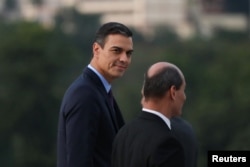 Spain's Prime Minister Pedro Sanchez (L) looks on as he arrives for a wreath-laying ceremony at the Jose Marti monument in Havana, Cuba, Nov. 22, 2018.