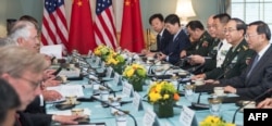 US Secretary of State Rex Tillerson(center left), and US Secretary of Defense Jim Mattis (obscured), hosts Chinese State Councilor Yang Jiechi, and Chief of the People's Liberation Army Joint Staff Department General Fang Fenghui, right, as the two countries start the US-China Diplomatic and Security Dialogue, June 21, 2017, in Washington.