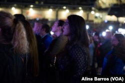 A Beto O’Rourke supporter attentively watches O’Rourke concession speech on Tuesday night, Nov. 6, 2018, after midterm election results.