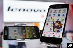 FILE - Lenovo shows its Vibe X smartphones at a trade fair in Berlin, Sept. 5, 2013.