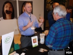 Cricket Flours Co-Founder Omar Ellis offers product samples in Portland last month. (Tom Banse)