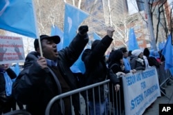 Uighurs and their supporters protest in front of the Permanent Mission of China to the United Nations in New York, March 15, 2018. Members of the Uighur Muslim ethnic group held demonstrations in cities around the world on that day to protest a sweeping Chinese surveillance and security campaign that has sent thousands of their people into detention and political indoctrination centers.
