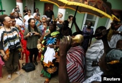 Chief of Nkwantakese, Nana Boakye Yam Ababio II, performs a traditional dance in front of members of a heritage tour group visiting his village, in Ashanti region, Ghana August 10, 2019. Picture taken August 10, 2019. REUTERS/Francis Kokorok