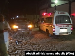 One of the Aamin ambulances waits outside Pizza House as Somali security forces end an al-Shabab siege of two Mogadishu restaurants early Thursday morning.