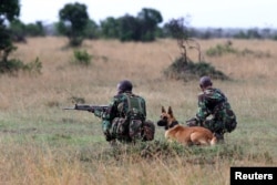 FILE - A special unit of wildlife rangers demonstrate an anti-poaching exercise ahead of the Giants Club Summit of African leaders and others on tackling poaching of elephants and rhinos, Ol Pejeta conservancy near the town of Nanyuki, Laikipia County, Kenya, April 2016.