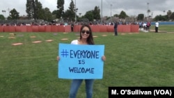 Volunteer at LAX Everyone is Welcome rally.