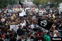 Demonstrators take part on a protest against a fuel price hike in Mexico City, Mexico, Jan. 9, 2017.