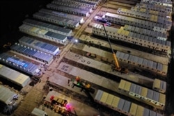 An aerial view shows workers at the construction site of a makeshift quarantine facility following a COVID-19 outbreak in Shaoxing, Zhejiang province, Dec. 18, 2021. (cnsphoto via Reuters)