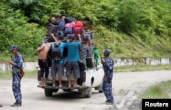 Ethnic Rakhine people who fled from Maungdaw after Arakan Rohingya Salvation Army (ARSA) had attacked, arrive in Buthidaung, Myanmar, Aug. 28, 2017.