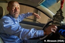 Ahmed Faraag supports three children by driving a taxi in Cairo. He says he won’t vote because it is not worth giving up his time at work, April 17, 2019.