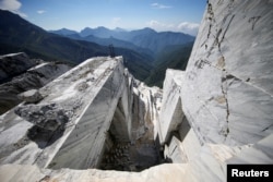 FILE - The Cervaiole marble quarry is seen on Monte Altissimo in the Apuan Alps, Tuscany, Italy, July 15, 2017.
